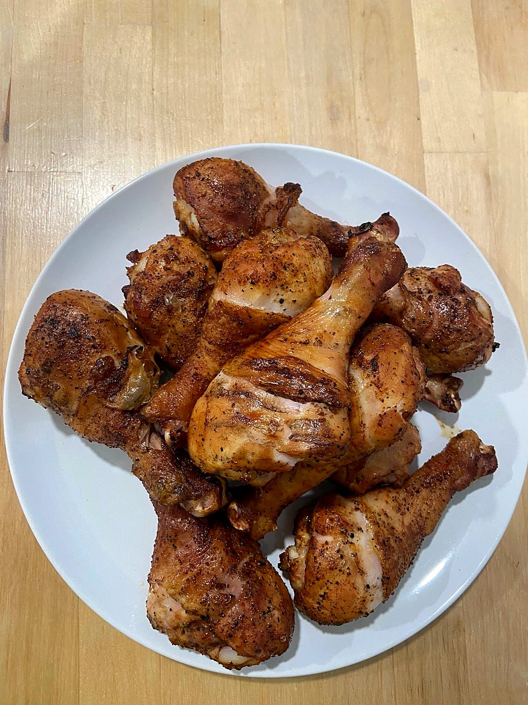 A plate of cooked drumsticks seasoned with The Cure All