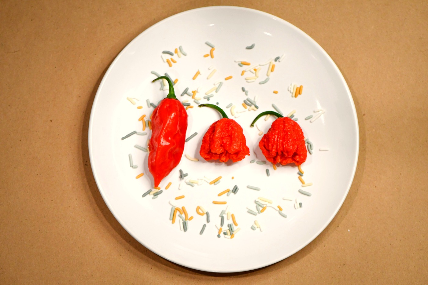 Peppers and spice flakes arranged on a plate