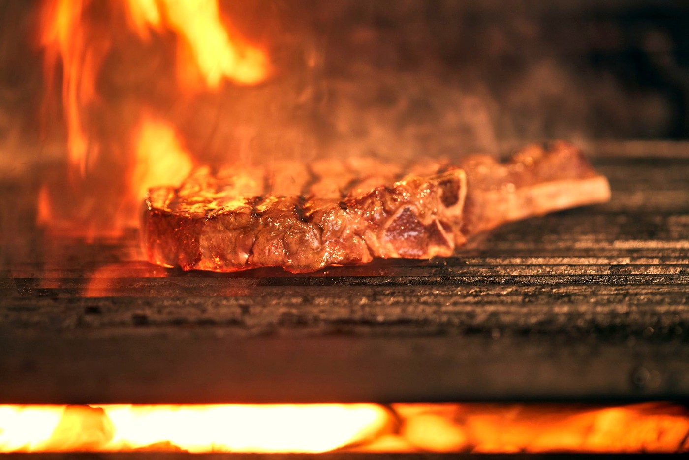 Steak searing over a wall of fire
